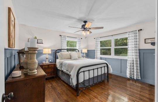 bedroom, wainscoting wall, hardwood flooring