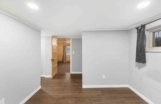 bedroom, laminate flooring, recessed lighting, window