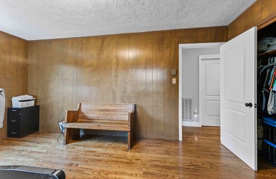 bedroom, paneling wall, hardwood flooring