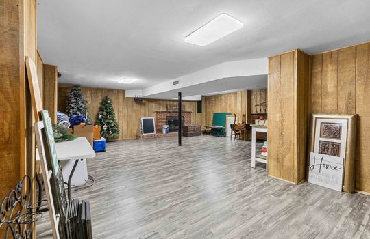 lower level bonus room, vinyl flooring, stairs to upper level, window