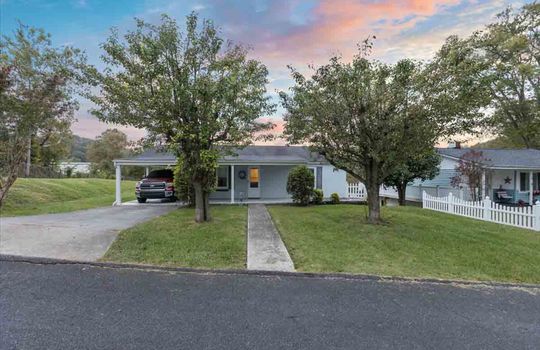 street view, front of home, carport, front door, sidewalk, front yard, trees, landscaping