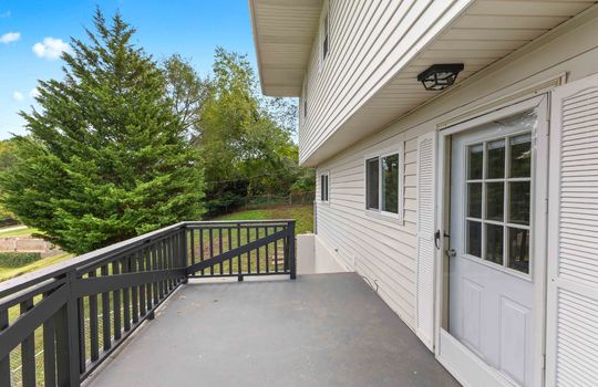 back deck, cottage, vinyl siding, concrete pad, exterior entry door