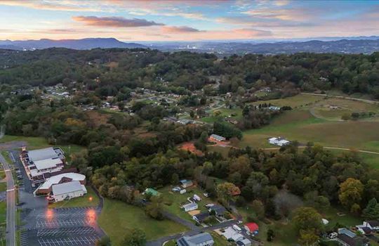 aerial photo of neighborhood, tress, mountains