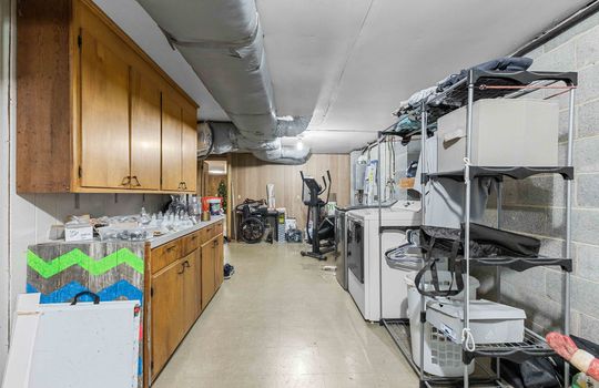 lower level laundry space, concrete flooring