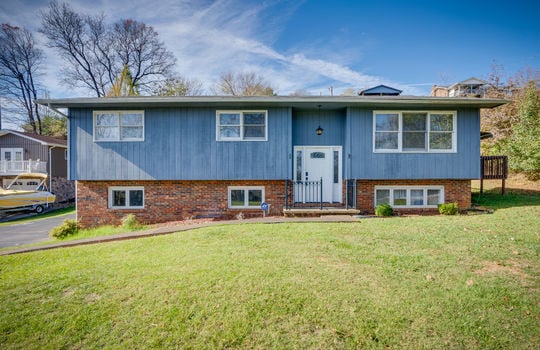 split foyer, front door, stairs, yard, landscaping