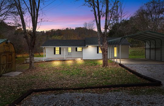 twilight photos, home, covered front porch, front door, vinyl siding, carport, covered carport