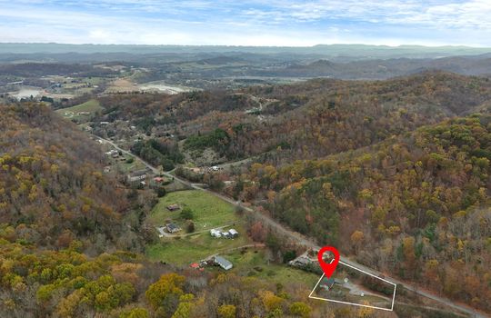 aerial view of neighborhood, mountains, mountain views, property outline, property marker, road, driveways