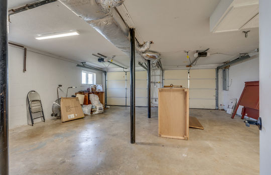 garage, concrete flooring, garage doors