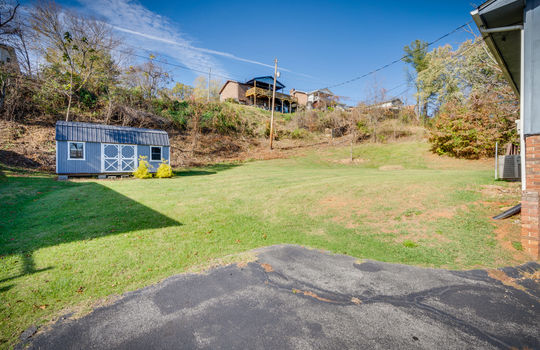 back yard, driveway, storage shed