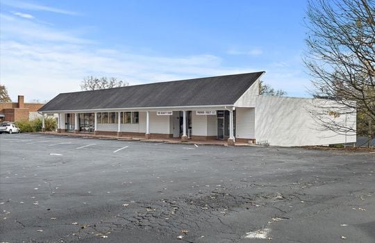 side view of commercial building, parking lot, commercial business space for lease