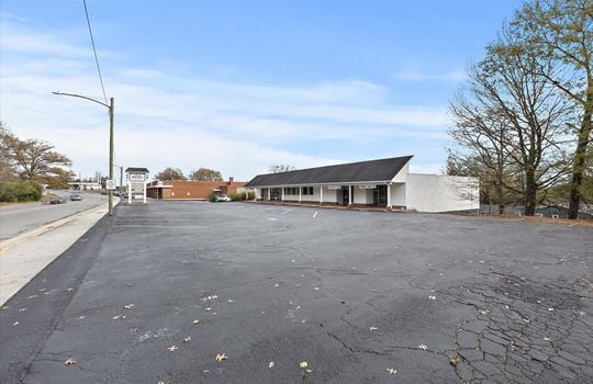 side view of commercial building, parking lot, commercial business space for lease