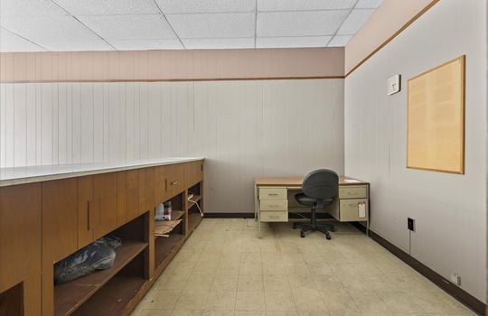 reception area, concrete flooring, built-in desk/shop counter