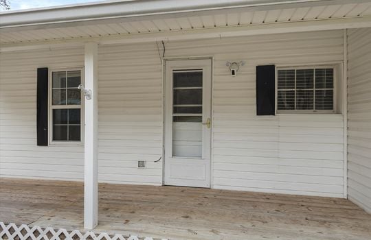 covered front porch, front door, storm door