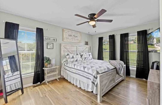 bedroom, windows, laminate flooring, ceiling fan, primary bedroom