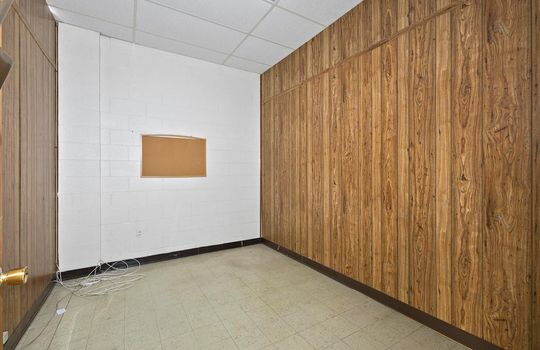 office, paneling walls, vinyl flooring