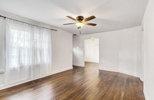 living room, hardwood flooring, ceiling fan, hallway