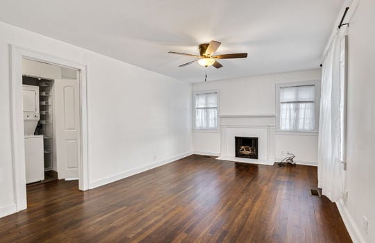 living room, hardwood flooring, ceiling fan, door