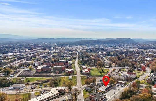 road, commercial business for lease, property marker, aerial photo, mountain views