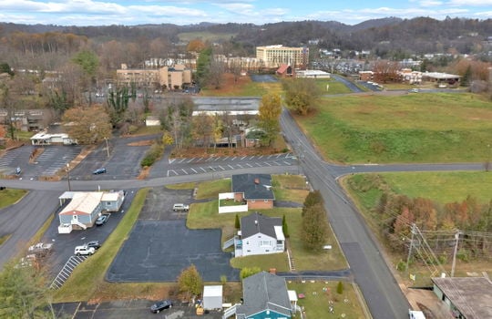 aerial photo of property, front view of property, front yard, back parking lot, neighboring homes & businesses, roads, mountain views, Hard Rock Hotel & Casino