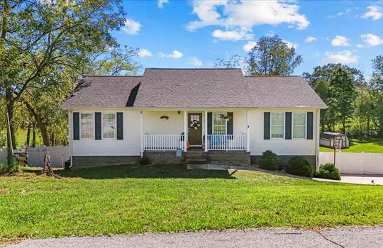 street view, front yard, ranch sytle home, covered front porch, front door, windows, roof, trees