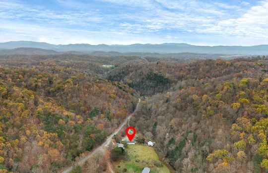 aerial photo, mountains, property, property marker, neighboring properties, road, driveways, mountain views