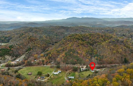 aerial photo, mountains, property, property marker, neighboring properties, road, driveways