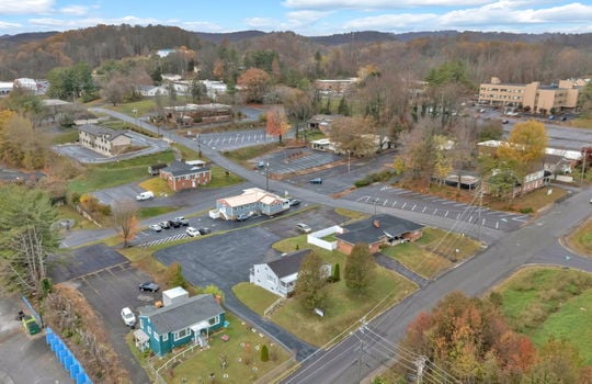 aerial photo of property, front view of property, front yard, back parking lot, neighboring homes & businesses, roads, mountain views, Hard Rock Hotel & Casino