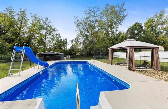 swimming pool, pergola, fenced back yard