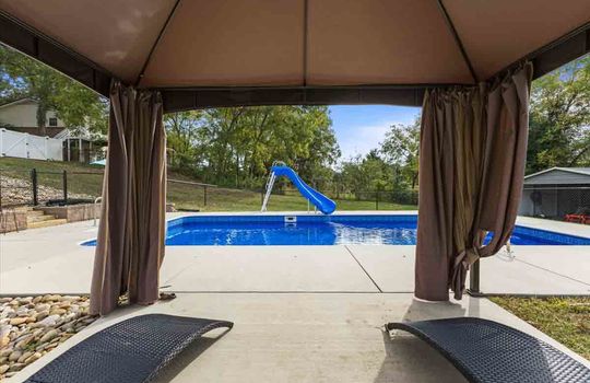 pergola view toward swimming pool and slide