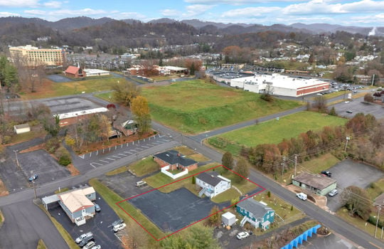 aerial photo of property, front view of property, front yard, back parking lot, neighboring homes & businesses, roads, mountain views, Hard Rock Hotel & Casino