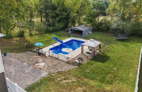 back yard, landscaping, fencing, swimming pool, pergola, fire pit, carport