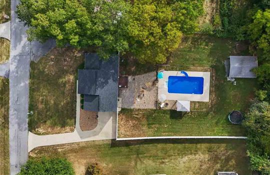 aerial view of home, front yard, home, driveway, back deck, swimming pool, trees