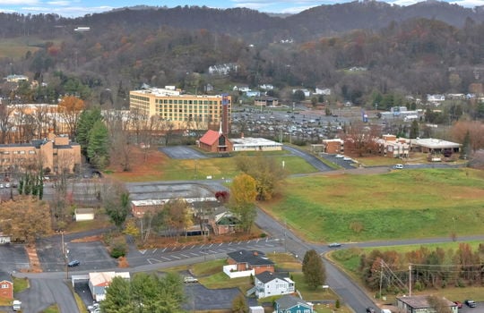 aerial photo of property, side view of property, front yard, back parking lot, neighboring homes & businesses, roads, mountain views, Hard Rock Hotel & Casino