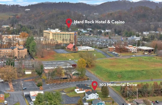 aerial photo of property, front view of property, front yard, back parking lot, neighboring homes & businesses, roads, mountain views, Hard Rock Hotel & Casino