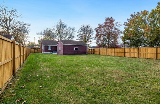 shed/home, back yard, security fencing, fenced back yard, back yard