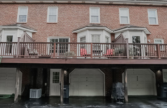 condo exterior, brick, balcony garage door