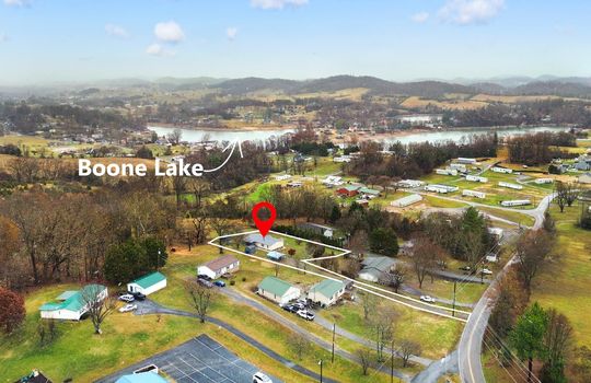 aerial photo, neighborhood, property outline, property marker, trees, mountain views, marker showing Boone Lake nearby