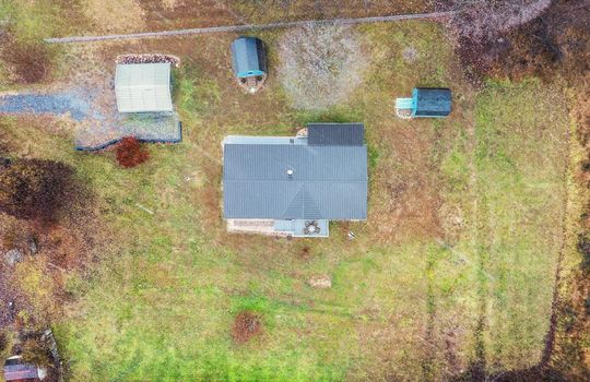 aerial photo, double wide, roof, metal roof, front yard, back yard, side yard, storage sheds, carport