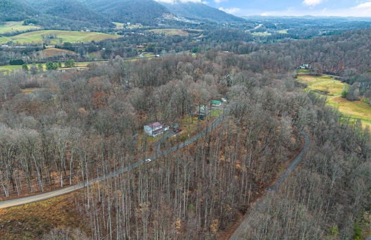 0.67 +/- acres, aerial photo, trees, mountain views, road, neighboring properties