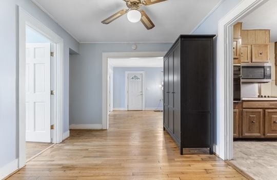 dining area, ceiling fan, hardwood flooring, doorway to living room, doorway to kitchen