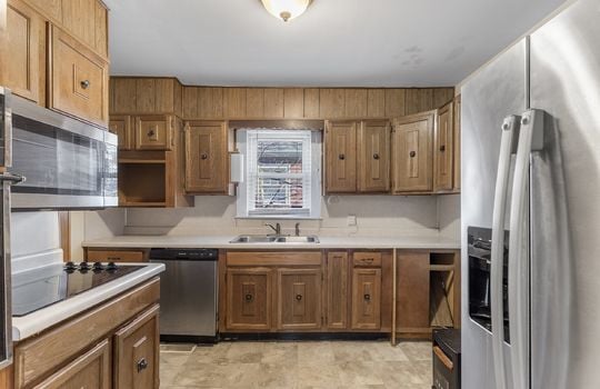 kitchen, vinyl flooring, refrigerator, dishwasher, cooktop, sink, cabinets, countertops