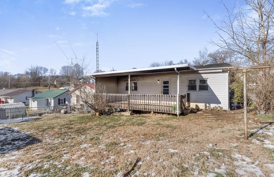 back yard, covered back deck, back of home