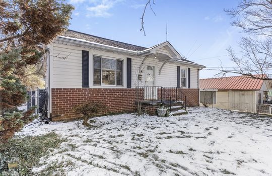 One Level Bungalow, sidewalk, stairs, front door, covered front porch, vinyl siding, brick, front yard, side view