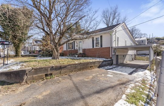 One Level Bungalow, sidewalk, stairs, front door, covered front porch, vinyl siding, brick, front yard, driveway, carport, trees