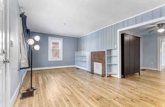 living room, hardwood flooring, painted paneling walls