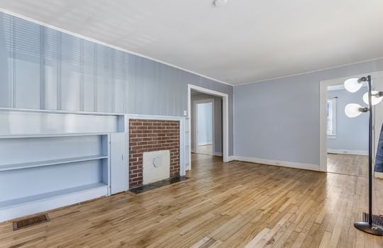 living room, hardwood flooring, built-in shelving,