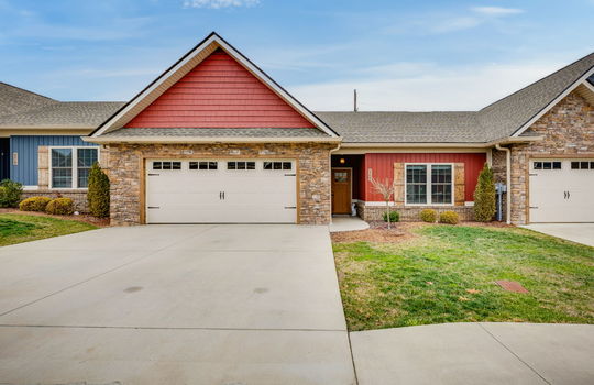 One level condo, garage, driveway, front door