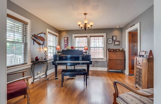 formal dining room, hardwood flooring, windows, chandelier