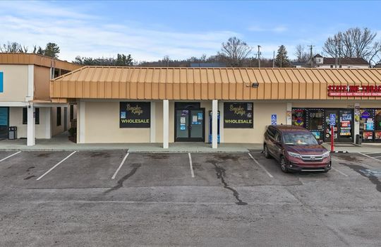 commercial property for lease, parking spaces, business front, front entrance, windows, covered entrance