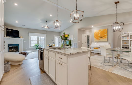 kitchen island, dishwasher, sink, granite countertops, living room, dining area, recessed lighting